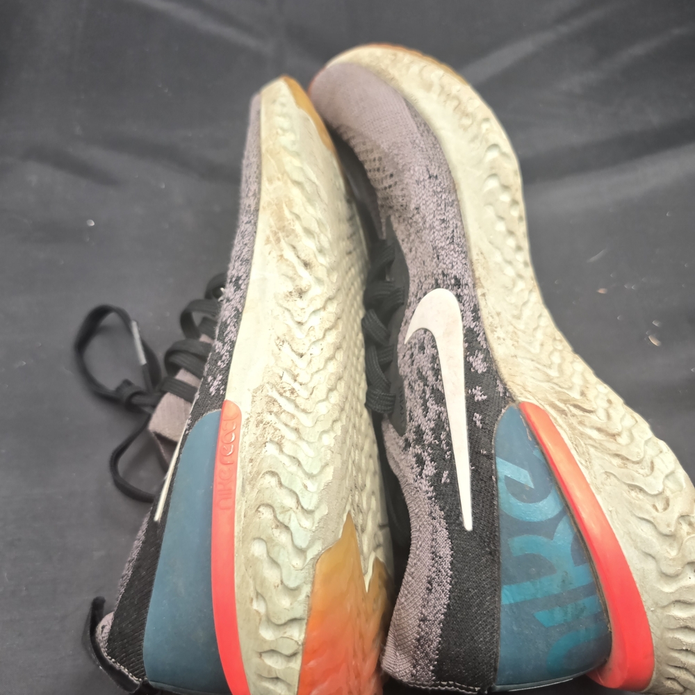 Nike Black and Orange Athletic Shoes with Dynamic Design